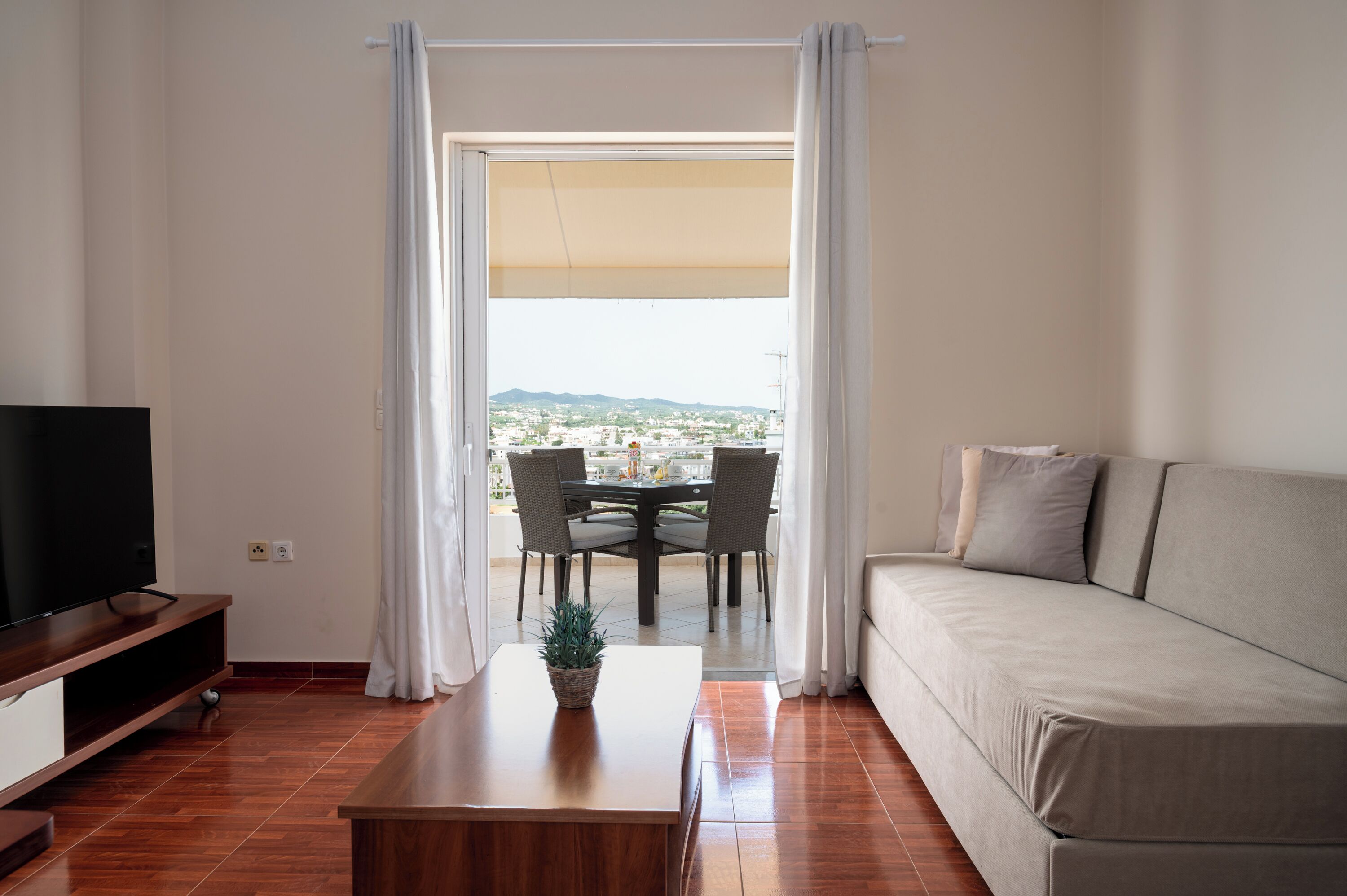 Apartment, Partial Sea View | Living area | 40-inch Smart TV with cable channels