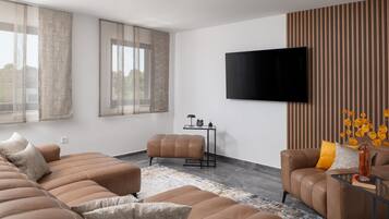 Luxury Apartment, Non Smoking, Sea View | Living area | 100-cm flat-screen TV with satellite channels