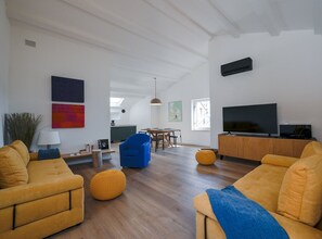 Apartment (One Bedroom Apartment) | Living room | 32-inch flat-screen TV with satellite channels - Radiant and Trendy Downtown Rovinj Apartment (Rovinj)