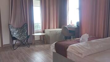 Desk, laptop workspace, free WiFi, bed sheets