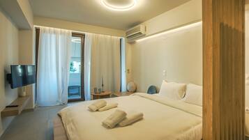 Deluxe Studio | Living area | 40-inch LED TV with cable channels