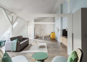 Comfort Suite with sofa bed | Living area | 50-inch Smart TV with satellite channels