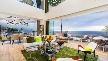 Apartamento premium, vista parcial para o mar | Área de estar