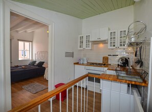 Studio (Studio Apartment) | Private kitchen | Fridge