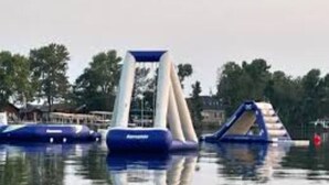 A water park with inflatable slides and a wave machine. - Cabin 19 - 1 Bedroom with spacious loft (Isle)