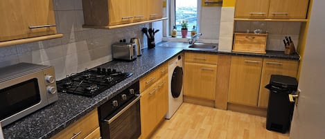 Standard Apartment, Partial Sea View | Private kitchen | Electric kettle, toaster