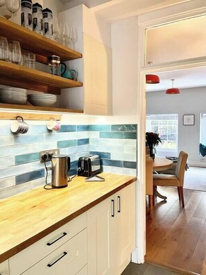 Enjoy cooking and dining in this well-equipped kitchen with a kettle, toaster, and coffee maker.