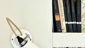 A wall-mounted lamp with a white shade and a rope handle. - Pulteney Bridge Suites - Apartment 2A (Bath)