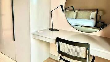 1 bedroom, desk, iron/ironing board, travel crib