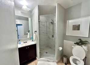 Shower, hair dryer, towels, soap