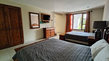 Desk, laptop workspace, blackout drapes, iron/ironing board