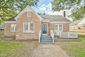 Classic single-story home with a gabled roof and inviting front porch.