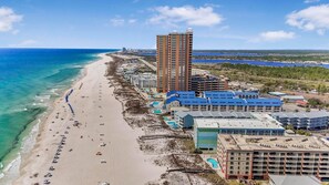 A coastal hotel with a beach, multiple buildings, and a clear view of the ocean. - Harbour Place 503 (Orange Beach)