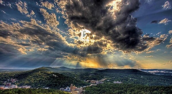 A landscape with a town nestled in a valley, surrounded by hills. - Vibrant Loft Steps from Bathhouse Row (Hot Springs)