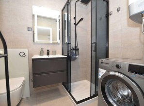 Shower, hair dryer, towels