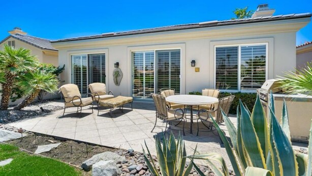 A patio with outdoor furniture, a grill, and a well-maintained garden. - Charming 1-bedroom Casita in gated Duna La Quinta. Walk to Old Town & LQ Resort (La Quinta)