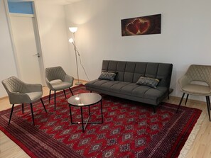 Living area - SeeVital vacation apartment - 4 minutes to Lake Constance. Quiet location with terrace. (Langenargen)