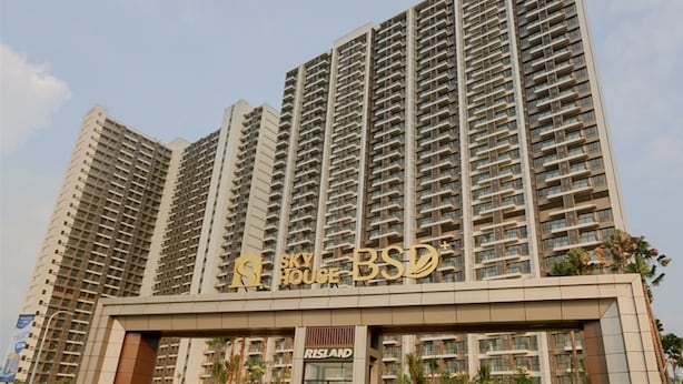 A high-rise building with multiple balconies and a sign that reads "Sky House B.S.D." - Well Design And Comfy Studio Sky House Bsd Apartment (Pagedangan)