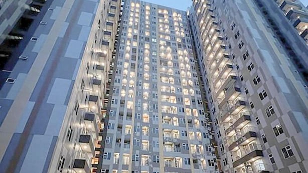 A high-rise building with multiple floors, each with balconies and windows. - Homey And Compact 2Br Podomoro City Deli Medan Apartment (Medan)