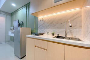 Deluxe Studio | Private kitchen | Fridge, stovetop, rice cooker - Warm And Simply Studio At Royal Sentul Park Apartment (Bogor)