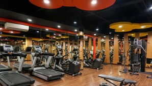 A gym with treadmills, elliptical machines, and weight equipment. - Strategic And Comfy Studio Apartment At Signature Park Grande (Jakarta)