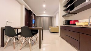 A modern kitchen with a microwave, toaster, and red container on the counter. - Modern And Stylish 2Br (No Kitchen) Apartment At Skales Residence Nusa Dua Bali (Nusa Dua)