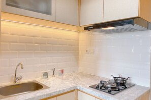 Deluxe Apartment | Private kitchen - Modern And Comfy 1Br At Vasanta Innopark Apartment (Cikarang)