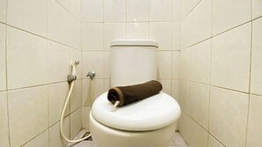 Deluxe Studio | Bathroom | Shower, free toiletries, towels, soap - Homey And Cozy Living Studio At Poris 88 Apartment (Tangerang)