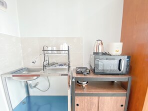 Deluxe Studio | Private kitchen - Compact Studio At Taman Melati Jatinangor Apartment (Hegarmanah)