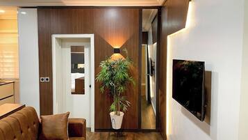 Family Apartment, Balcony, City View | Living area | Flat-screen TV