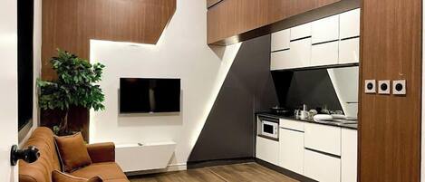 Family Apartment, Balcony, City View | Living area | Flat-screen TV