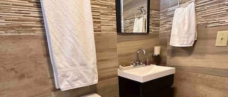 Shower, hair dryer, towels, soap