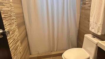 Shower, hair dryer, towels, soap