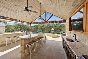 Outdoor dining - Stunning 6 Bedroom vacation home with pool & hot tub 5 minutes from Frio River! (Sabinal)