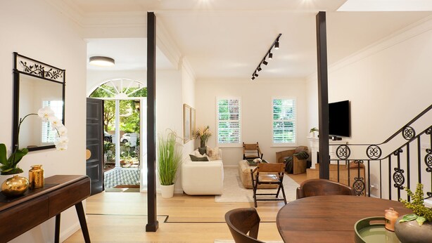 A modern living room with a dining area, a staircase, and a view of the outdoors. - Sweet Juliet, Double Bay (Double Bay)