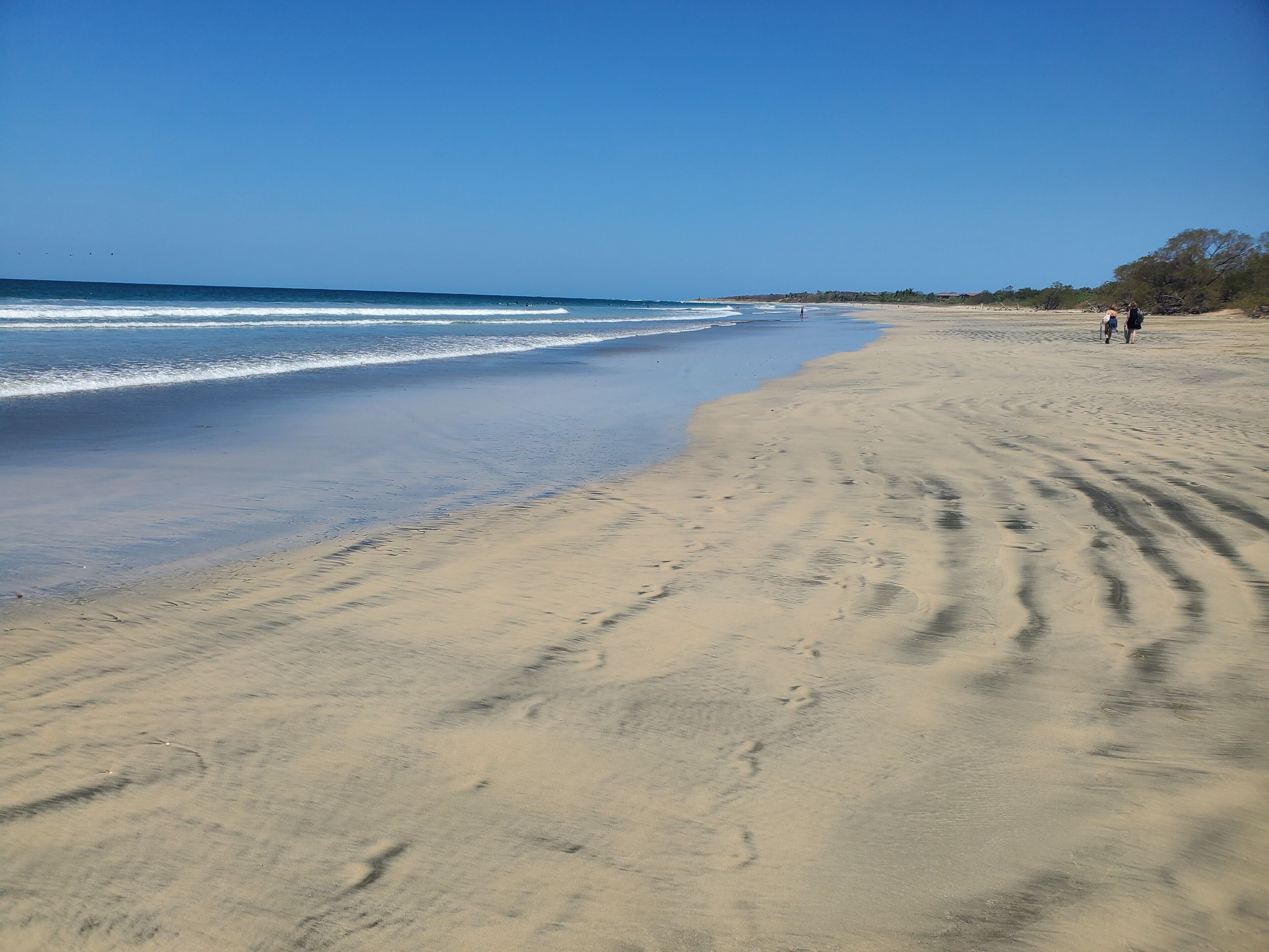 Beach nearby, white sand, beach towels