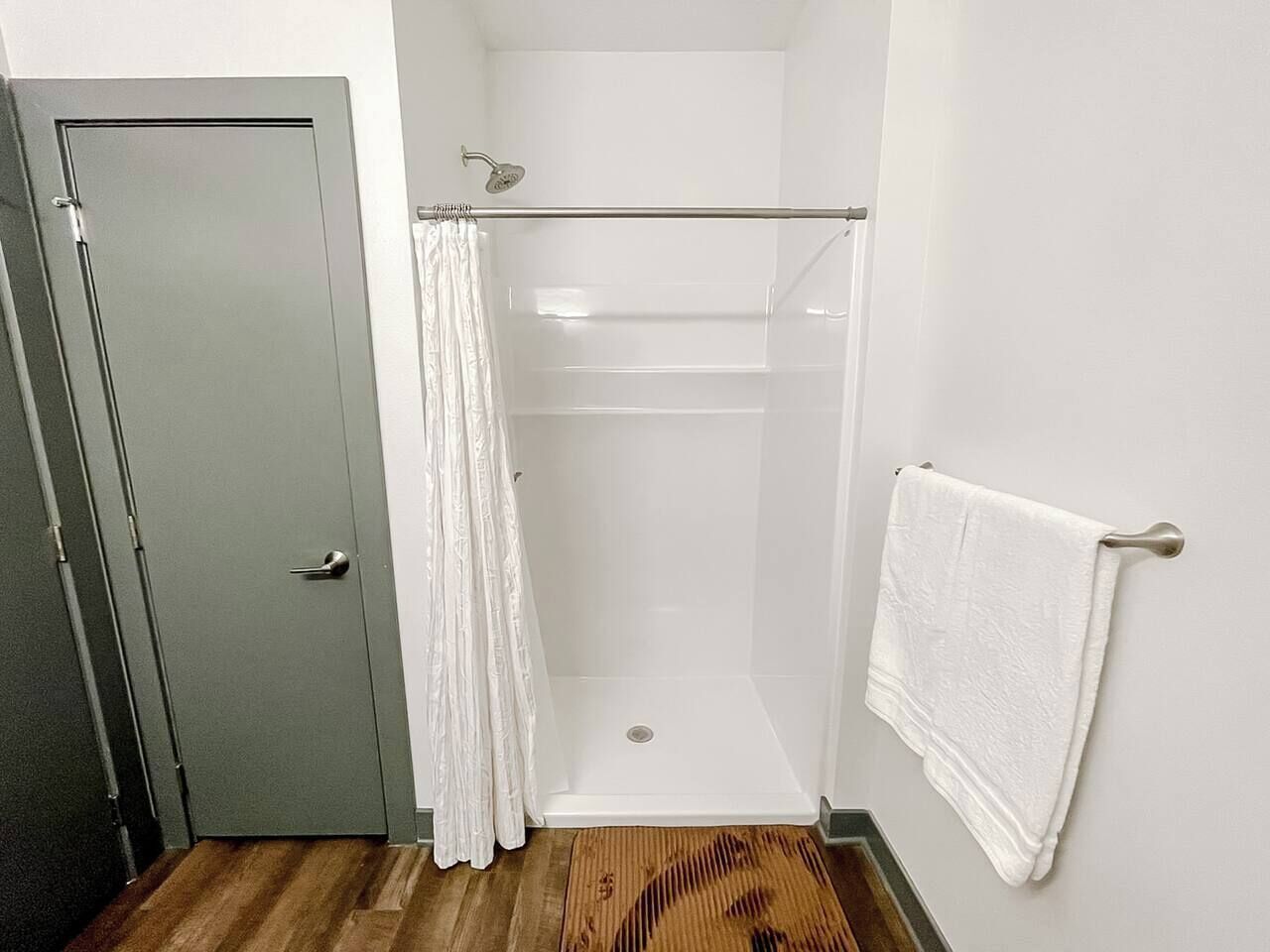 Shower, hair dryer, towels, toilet paper