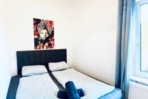 1 bedroom, desk, bed sheets
