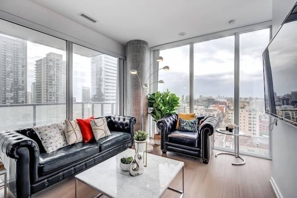 Business Apartment | Living area | 65-inch Smart TV with digital channels