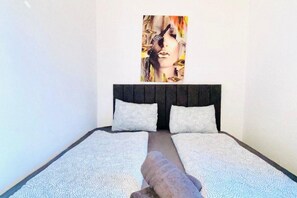 1 bedroom, desk, bed sheets
