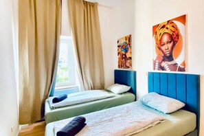 1 bedroom, desk, bed sheets