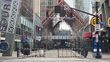 A street view with a traffic light, a no right turn sign, and a 'One Way' sign on Liberty Street.