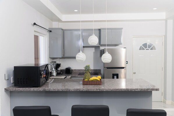 Fridge, microwave, coffee/tea maker, toaster