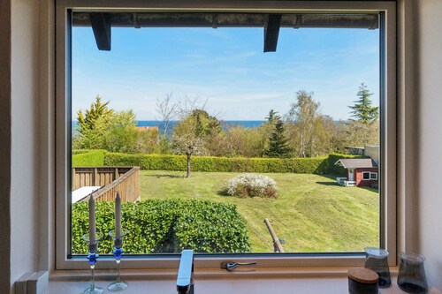 Modern holiday home with sea view in Tejn