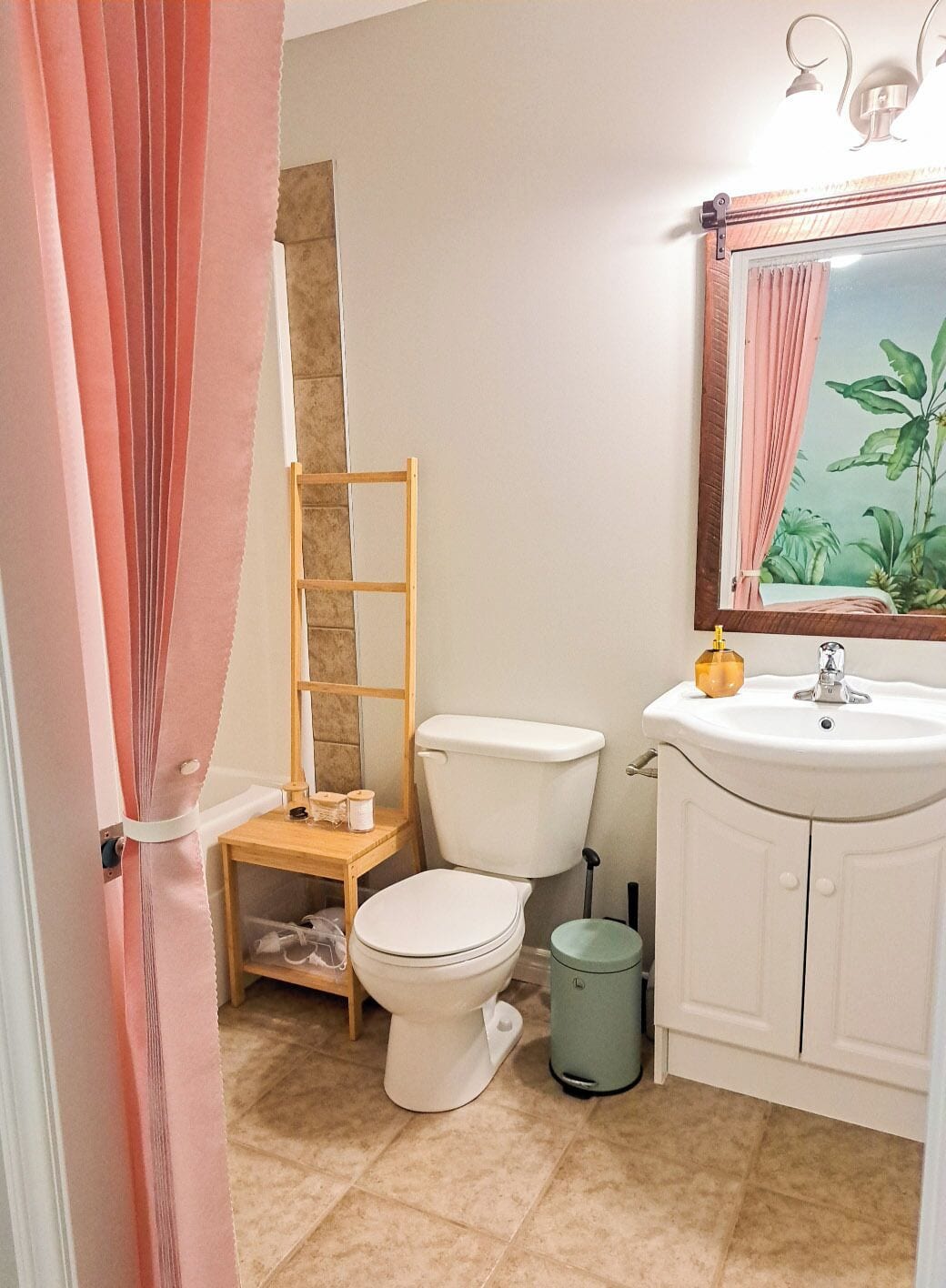 A bathroom with a toilet, sink, and a small shelf with toiletries.