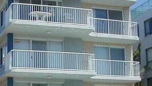 A multi-story building with balconies on each floor.
