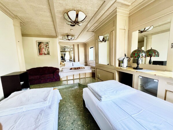 Economy Quadruple Room, Multiple Beds, Non Smoking, Private Bathroom | Blackout drapes, soundproofing, bed sheets