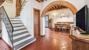 A staircase with a metal railing leading to a wooden door. - Chianti Site Fienile Shared Pool, Castelfiorentino, Italy (Castelfiorentino)
