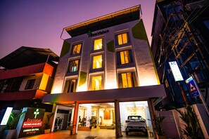 A hotel with a modern design, labeled "Eco Value," featuring multiple rooms and a visible entrance. - EcoValue Kochi - 200 meters from Kerala High Court (Kanayannur)