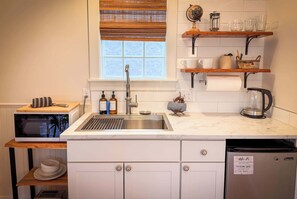 Fridge, microwave, coffee/tea maker, toaster